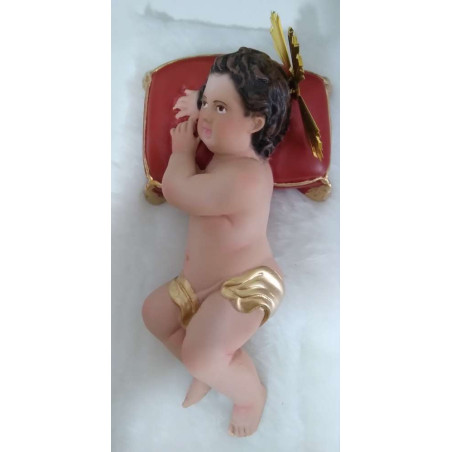 Niño Jesús con almohadón y piel 20cm.