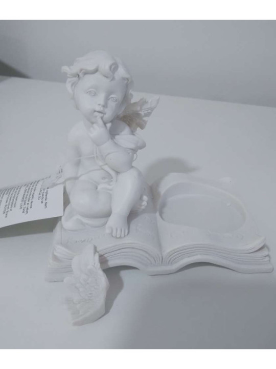 Producto pequeña Tara. Portavelas Querubín Blanco Sentado en Libro.. 8 cmx 9,5 cm ancho. Ala rota
